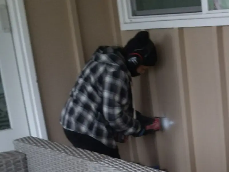 Professional electrician installing an exterior outlet in Selma